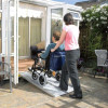Axcess suitcase wheelchair ramps in use at a house